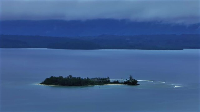 Mushi Yuo Sand Island untouched pristine remote island harbor view Wewak Papua New Guinea PNG aerial drone early morning rain fog clouds summer dry season Cape Wom Public beach circle right motion