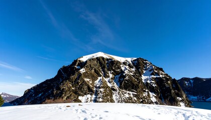 Snowy mountain peak under a clear blue sky