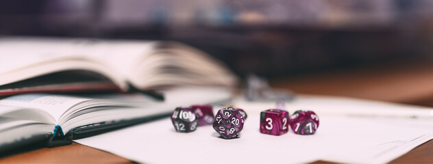 Violet dice place for adventure story TTRPG role playing tabletop game and board game hobby