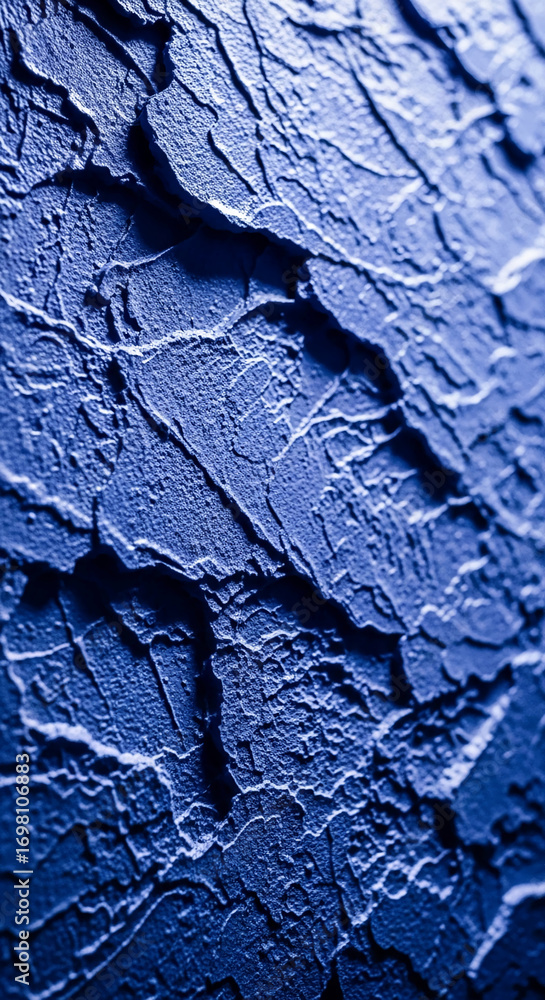 Poster close-up of deep blue textured surface, showing cracked and uneven pattern, ideal for background or 