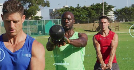 Swinging Black man in green tank top holding kettlebell on grass sports field, with digital metrics