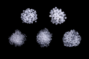 Close-Up View of Silica Gel Beads in Grouped Arrangements on a Black Background