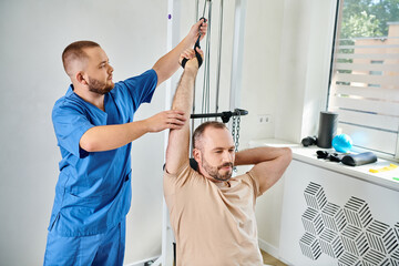 Rehabilitation training session with dedicated physiatrist at a modern recovery facility