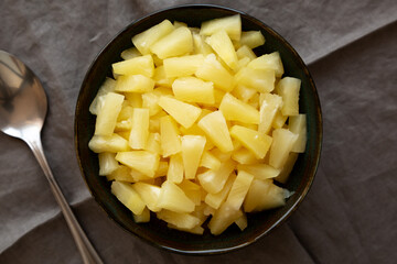 Canned Pineapple Tidbit Chunks in a Bowl, top view.