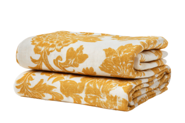 Two folded blankets, mustard yellow floral damask pattern on cream background