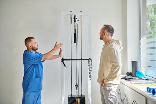 Patient consultation in rehabilitation center focused on physical recovery techniques