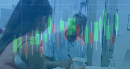 Office coworkers discussing financial candlestick chart overlay in kitchen area, with notebook pen