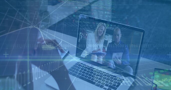 Conducting remote meeting user viewing laptop at office with smartphone tablet and data overlays