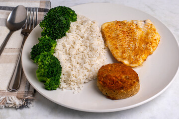 baked haddock and crab cake  with  rice