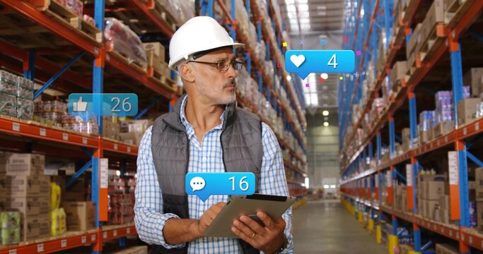 Inspecting worker in safety gear recording inventory on tablet in warehouse, with reaction icons