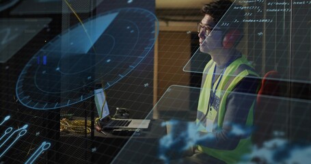 Mature Korean engineer wearing vest monitoring radar overlays on laptop in control hub, copy space