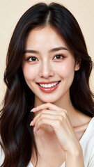 A close-up, candid studio portrait of a lovely Asian woman, radiating joy with a bright, genuine smile and captivating charm