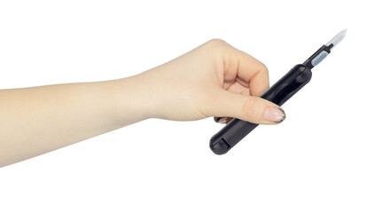 multitool for cleaning headphones in hand, outstretched hand with multitool for cleaning headphones isolated on background