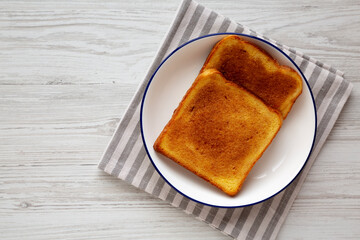 Homemade American Cinnamon Toast with Butter and Orange Juice, top view. Copy space.