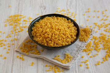 Homemade Perlini Pasta in a Bowl, side view.