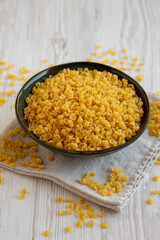 Homemade Perlini Pasta in a Bowl, side view.