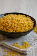 Homemade Perlini Pasta in a Bowl, side view. Close-up.