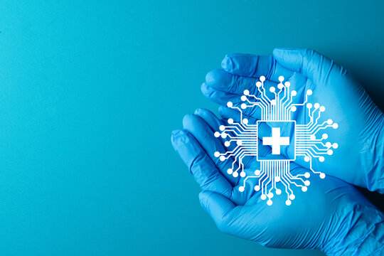 Doctor's hands hold a medical technology icon. A concept for HealthTech, digital health, and innovation in healthcare. A symbol for modern medicine, e-health, and telemedicine services.
