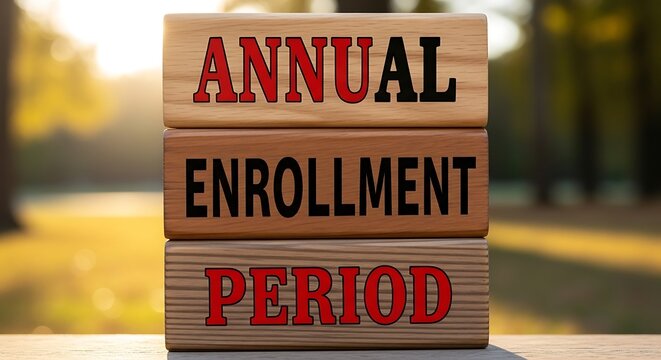 Wooden blocks displaying annual enrollment period outside in soft bokeh lighting - Powered by Adobe