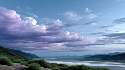 Vast valley at twilight, dramatic clouds