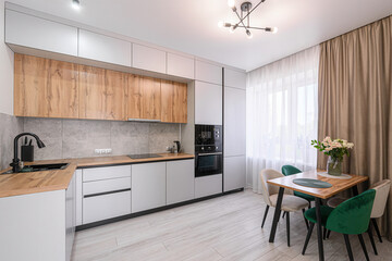 dining area. Light flooring and natural light enhance the clean, contemporary feel