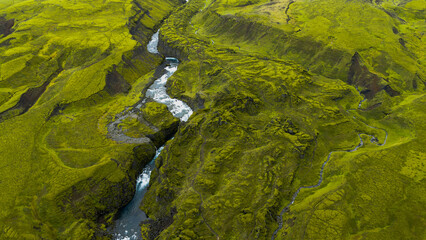 Aerial View of Winding River Through Rugged Icelandic Terrain