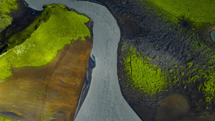 Aerial View of Winding River in Moss Covered Icelandic Landscape