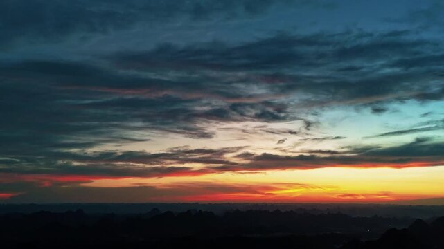 Golden and Orange Sunset Over Guangxi Karst Mountains