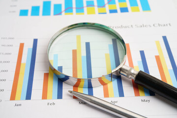 Magnifying glass on charts graphs paper. Financial development, Banking Account, Statistics,...