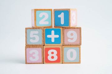 Number wood block cubes for learning Mathematic, education math concept.