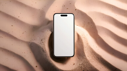Contemporary smartphone with a blank screen displayed against an artistically rippled sand texture under soft lighting, showcasing modern design and style.
