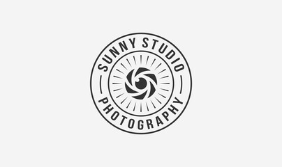 studio photographer stamp logo design with the sun and lens element.