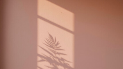 Shadow of fern leaves projected on pale rose-colored wall, creating minimalist and tranquil aesthetic. Serene composition emphasizes simplicity, delicate shapes, and harmonious tones.