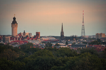 Obraz premium City view of Leipzig with New Town Hall, Peters Church, and broadcasting tower