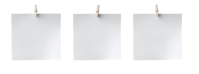 Three blank square pieces of paper, each with a wooden clothespin