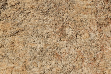 close up of yellow stone surface texture 