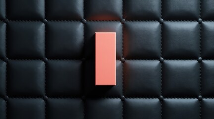 Single salmon colored block centered on black tufted background