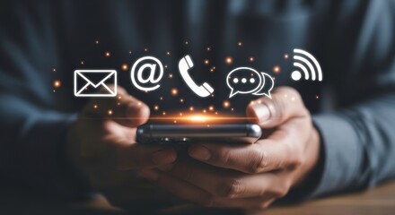 Person holding a smartphone with email, at symbol, phone, chat, and wifi icons above it