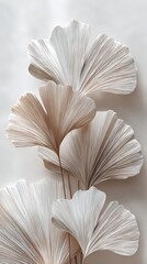 Elegant, fan-shaped leaves with intricate lines create a delicate and artistic composition on a neutral background.