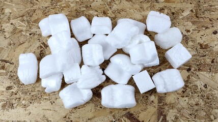 Styrofoam Chips in a Group on a Wooden Background