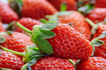Closeup view of fresh ripe strawberry. Harvest of red berries