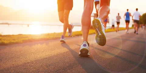Fototapete Rund Laufen Background of healthcare. Exercise of a group of people jogging along the riverside at sunrise reflects health care.  © guguart