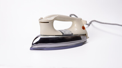 Vintage electric iron on white, perfect for laundry and household concepts.