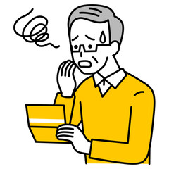 預金通帳を見て困惑する年配の男性