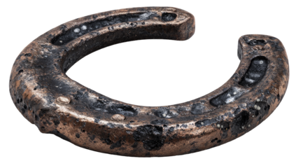 Rusty horseshoe, aged and weathered.  A curved, worn metal horseshoe, showing signs of corrosion and age