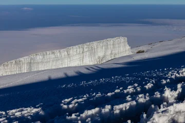 Fototapeten Gletscher Mount Kilimanjaro hiking trail, way to the summit of mount Kili the highest volcano in Africa, Tanzania. View from top of mountain Kilimanjaro. Snow and glacier on top of Kilimanjaro, Mount Kili  © Yuliia