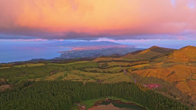 Hills, Forest and Lagoon Canario at Sunset. Atlantic Ocean. Azores, Sao Miguel Island, Portugal. Aerial View. Drone Moves Back