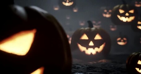 Spooky halloween pumpkins glowing in the dark with scary faces for october fun