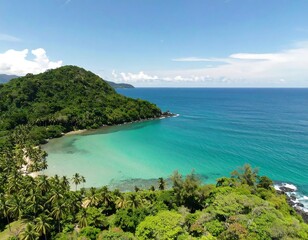 Tropical bay with lush green hills
