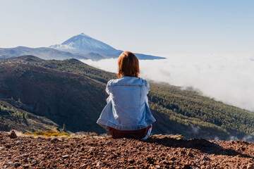 Tourist admiring breathtaking view of volcano Teide. Tenerife, Canary Islands, Spain.